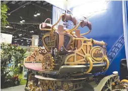  ??  ?? This Nov. 14, 2017 photo provided by Silver Dollar City and Mack Rides shows a car from the Time Traveler ride on display at a theme park expo in Orlando, Fla. The Time Traveler ride, billed as the fastest, steepest and tallest spinning roller coaster,...