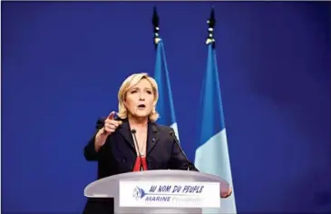  ?? ANNE-CHRISTINE POUJOULAT/AFP ?? French presidenti­al election candidate for the far-right National Front party Marine Le Pen delivers a speech during a campaign meeting on Wednesday in Marseille.
