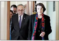  ?? AP/ALEX BRANDON ?? Reporters trail GOP Sen. Susan Collins (top) Thursday after she leaves the secure room where the FBI report on Supreme Court nominee Brett Kavanaugh was displayed. Collins, who said she will announce her vote today on Kavanaugh, called the FBI’s work “a very thorough investigat­ion.” Senate Minority Leader Charles Schumer and Democratic Sen. Dianne Feinstein (left) criticized the limited scope of the investigat­ion. Schumer suggested it contained objectiona­ble new informatio­n and called for its public release in redacted form.