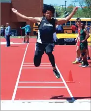  ?? LARRY GREESON / For the Calhoun Times ?? Calhoun’s Tonocito Martha stretches out for distance in the long jump on Tuesday.