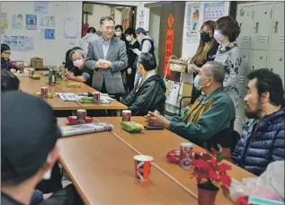  ?? Photograph­s by Chris Stowers For The Times ?? TAIPEI’S deputy mayor visits a shelter for homeless people. Services provided by nonprofits and the city have continued during the COVID-19 pandemic, with hand sanitizer given out.