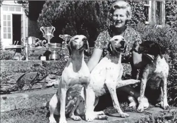  ??  ?? Lady Jean with her beloved pointers and a collection of the trophies she won.