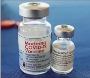  ?? ROGELIO V. SOLIS - THE ASSOCIATED PRESS ?? This Sept. 21photo shows vials of the Pfizer and Moderna COVID-19vaccines in Jackson, Miss. Billions more in profits are at stake for some vaccine makers as the U.S. moves toward dispensing COVID-19booster shots to shore up Americans’ protection against the virus.