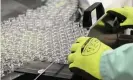  ?? Photograph: Vincenzo Pinto/ AFP/Getty Images ?? A lab technician handles vials as part of filling and packaging tests for the largescale production and supply of the Oxford Covid vaccine.