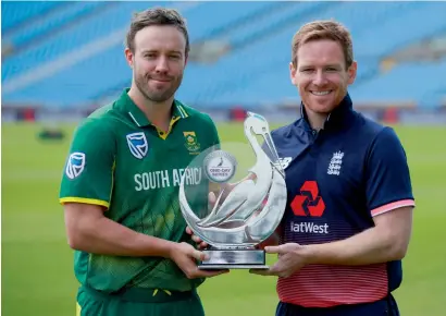  ?? Reuters ?? South Africa’s AB de Villiers and England’s Eoin Morgan pose with the ODI series trophy in Headingley on Tuesday. —