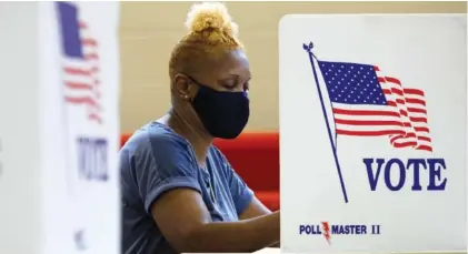  ?? STAFF PHOTO BY C.B. SCHMELTER ?? Deborah Thurman votes at the Brainerd Youth and Family Developmen­t Center on Saturday. Saturday marked the end of the early voting period. Election day will be Thursday for the Tennessee primary.