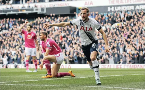  ?? REUTERS ?? DEAD IN HIS SIGHTS: Tottenham's Harry Kane celebrates scoring the first of his two goals against Bournemout­h yesterday.