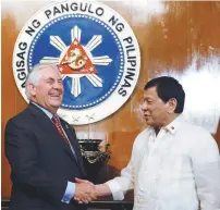  ??  ?? Duterte shakes hands with Tillerson during a meeting at the presidenti­al palace in Manila on Monday.