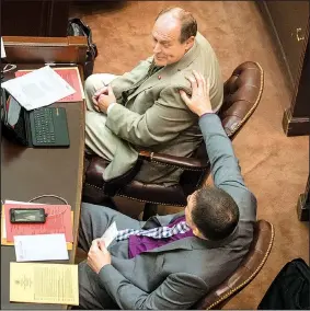  ?? Arkansas Democrat-Gazette/BENJAMIN KRAIN ?? Rep. Clint Penzo, R-Springdale (bottom), comforts Rep. Johnny Rye, R-Trumann, after Rye’s bill failed to pass by two votes Monday afternoon in the House. However, Monday evening, the House voted again and approved the bill to use a portion of sales tax...