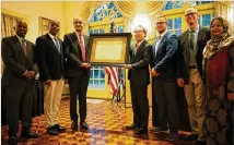  ?? COURTESY OF GEORGIA ASIAN TIMES ?? The Guinea Worm Eradicatio­n Program, led by The Carter Center, was honored with the Fourth Hideyo Noguchi Africa Prize in the medical services category at the residence of the Consul General Mio Maeda (fourth from right).