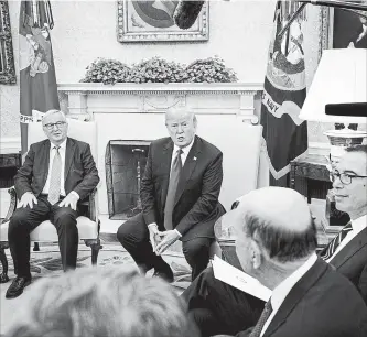  ?? DOUG MILLS NEW YORK TIMES ?? President Donald Trump during a meeting with EU President Jean-Claude Juncker in the Oval Office on Wednesday with Treasury Secretary Steven Mnuchin and Commerce Secretary Commerce Wilbur Ross.