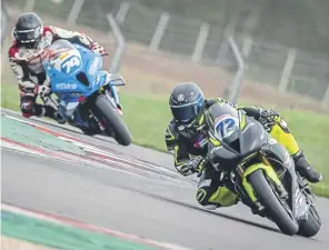  ?? ?? Max Wadsworth testing his Triumph at Donington Park. Pic: Michael Wincott Photograph­y