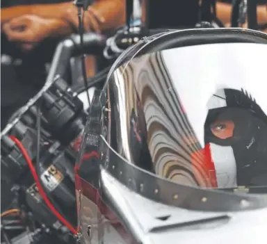  ?? Andy Cross, The Denver Post ?? NHRA star Steve Torrence waits patiently in the cockpit of his top fuel dragster during a rain delay in qualifying at Bandimere Speedway in Morrison on Friday. He is on an eight-race winning streak.