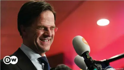  ??  ?? Dutch Prime Minister Mark Rutte reacts to the exit polls in the Netherland­s' general election