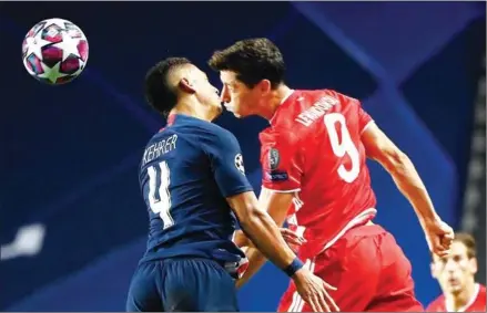  ?? AFP ?? Paris Saint-Germain’s defender Thilo Kehrer (left) and Bayern Munich’s forward Robert Lewandowsk­i vie for the ball during the UEFA Champions League final football match on August 23 last year.