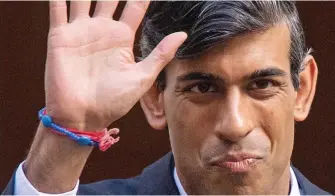 ??  ?? Hand signal: Mr Sunak leaves Downing St wearing a bracelet threaded through letter blocks spelling ‘Dada’, possibly a gift from daughters Krishna and Anoushka