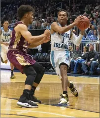  ?? Photo by Michael Derr / The Independen­t ?? URI guard Fatts Russell (1) and the Rams begin the season Tuesday against Long Island at the Ryan Center.