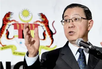  ??  ?? Guan Eng giving a speech during press conference. — Bernama photo