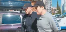  ?? AP-Yonhap ?? Montenegri­n police escort Terraform Labs founder Do Kwon in Podgorica, March 24, 2023.