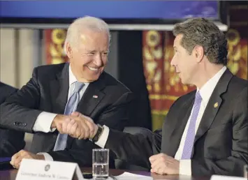  ?? Skip Dickstein / Times Union archive ?? Vice President Joseph Biden shakes hands with Gov. Andrew Cuomo at the Capitol in 2014. Observers see a better relationsh­ip between New York and Washington in the next term.