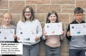  ??  ?? Pupils praised P6/7 class winners Chiara Cummings, Charlotte Brierley, Jasmine Whyte and David Szumla