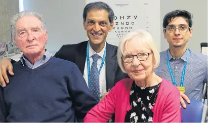  ??  ?? Douglas Waters, left, and wife Freda with eye experts Lyndon da Cruz and Odysseas Georgiadis yesterday