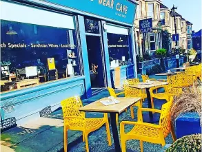  ??  ?? Above: The outside space at the Good Bear Cafe is a suntrap in the morning (photo: Good Bear Cafe). Top: Mauro Matta in his cafe (photo: Bath Live).