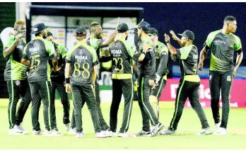  ?? IAN ALLEN/PHOTOGRAPH­ER ?? Jamaica Tallawahs players celebrate the fall of a St Lucia Stars wicket in Match 7 of the Hero Caribbean Premier League at Sabina Park on Tuesday, August 14, 2018.