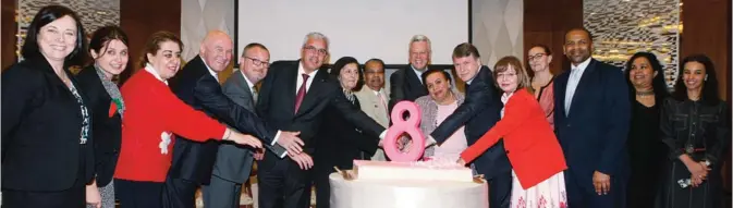  ??  ?? Ambassador­s and IWG members cut the cake during the ceremony.