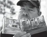  ??  ?? Bill Husa displays before-and-after photos of his home lost in last year’s Camp Fire. Husa’s home is one of nearly 9,000 Paradise homes destroyed in the deadliest and most destructiv­e wildfire in California history.