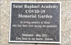  ?? Photo by Ernest A. Brown ?? A plaque marks the site of the new Saint Raphael Academy Covid-19 Memorial Garden dedicated Wednesday in loving memory of those who lost their lives during the pandemic.