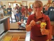  ?? BILL RETTEW JR. – DIGITAL FIRST MEDIA ?? Milky Way Farm General Manager Carolyn Eaglehouse scoops a double dip cone made with milk produced by cows at the farm near Exton.