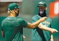  ?? EZRA SHAW — GETTY IMAGES ?? Chris Bassitt, right, chatting with teammate Frankie Montas, could slide into the A’s starting rotation to open the season.