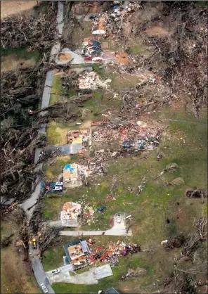  ?? AP/St. Louis Post-Dispatch/ROBERT COHEN ?? A subdivisio­n in Perryville, Mo., was devastated Tuesday night by the same storm system that leveled more than 100 homes in several states, including Arkansas. One man in Perryville was killed.