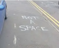  ??  ?? The scene outside Tesco in Ramsbottom after a motorist spray painted a warning to other shoppers