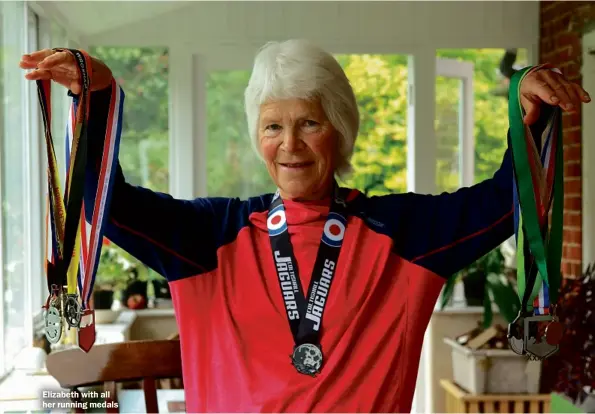  ??  ?? Elizabeth with all her running medals
Xxxx