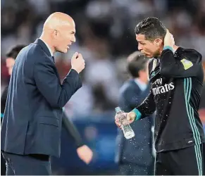  ?? — Reuters ?? Are we on the same page?: Zinedine Zidane (left) talking to Cristiano Ronaldo during the Club World Cup semi-final in Abu Dhabi, United Arab Emirates, last December.