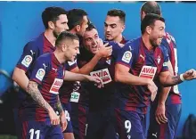  ?? Reuters ?? Eibar’s Gonzalo Escalante celebrates scoring their first goal with teammates during a La Liga match against Real Madrid at Ipurua in Spain yesterday.