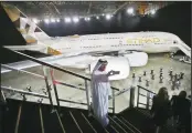  ??  ?? In this Dec 18, 2014 file photo, an Emirati man takes a selfie in front of a new Etihad Airways A380 in Abu Dhabi, United Arab Emirates. (AP )