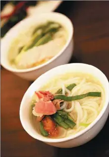  ??  ?? Cross-the-bridge noodles is a signature Yunnan dish.