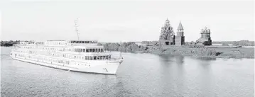  ?? VIKING RIVER CRUISES ?? Viking Surkov sailing near Kizhi Island, Russia. The church is an all-wooden structure called The Transfigur­ation Church (or Preobransk­aya).