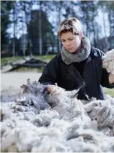  ??  ?? CLOCKWISE FROM ABOVE Kerry sorts through the fleeces to be spun into the 100 per cent wool and alpaca yarn; her kits and finished products are available to buy online and at the studio – Kerry also employs local women to knit them up