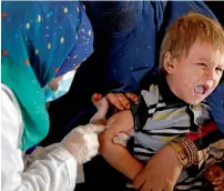  ?? Reuters ?? An Afghan refugee child is vaccinated after arriving at a UNHCR registrati­on centre in Kabul.