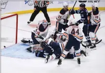  ?? Canadian Press photo ?? Winnipeg Jets' Paul Stastny (25) scores on Edmonton Oilers goaltender Mikko Koskinen (19) during third period NHL action in Winnipeg on Tuesday.