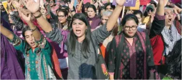  ?? Associated Press ?? ↑
Activists raise slogans during a rally to mark Internatio­nal Women’s Day in Lahore on Friday.