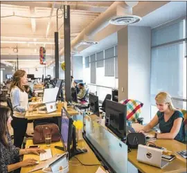  ?? David Butow For The Times ?? THE IPO for Slack Technologi­es could take place toward mid-2019, a source says. Above, employees at the company’s headquarte­rs in San Francisco in 2015.