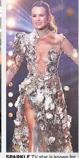  ??  ?? SPARKLE TV star is known for her daring plunging necklines