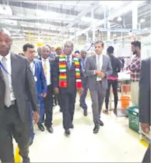  ??  ?? President Mnangagwa (wearing scarf) tours the Bole Lemi Industrial Park in Addis Ababa, Ethiopia, recently