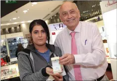  ??  ?? Winopoly winner Brigid Breen presented with a diamond ring by John Swan at the Bridgewate­r Shopping Centre.