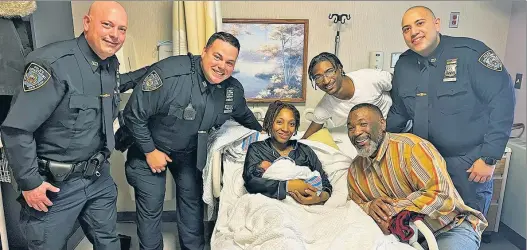  ?? ?? BABY BLUE: Cops from the 103rd Precinct in Queens, Christian Mele (from left), Kevin Kelland and Justin Rodriguez, pay a visit Thursday to parents Sade James and Justin Clausell (center, with James’ dad) and newborn Syre Jeremiah Clausell, whom the officers delivered the previous day.